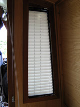 CUSTOM DESIGNED BLINDS, SHUTTERS AND SHADES, BOAT WINDOW